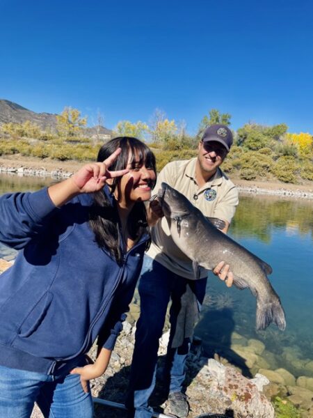 A STRIVE student catching a fish at Lake Lehow!