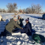 Winter training with Global Emergency Medics. Two instructors treat a patient.