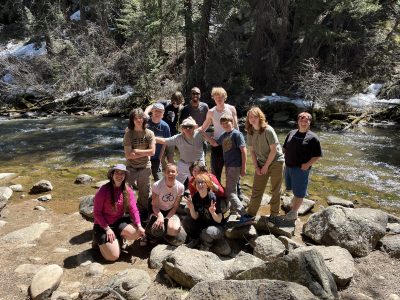 NVHS CAP Class poses together in front of a river