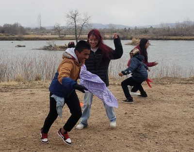 AXL students play a game during their field day fishing adventure.