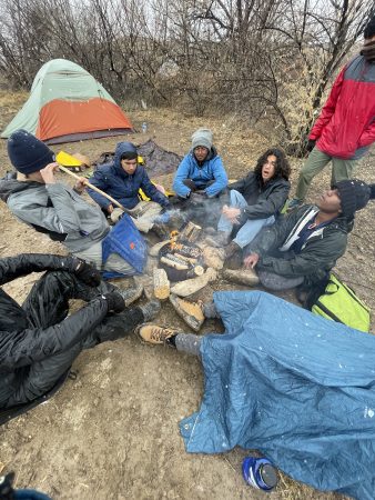 Peak to Peak students enjoy a fire before they head out for their backpacking trip through Dominguez Canyon.