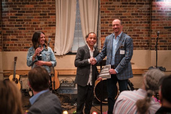 The Lauren Guthrie Award is given to Mekhi at the Cheers to 20 Years Bash 2025 event.