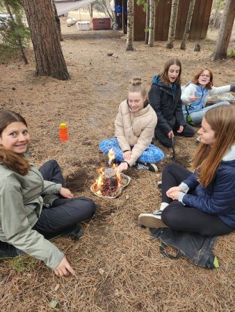 Angevine students perfect their fire-building skills at Cheley Outpost.