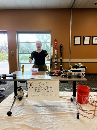 A Changemaker student displays tools for ski repair at the gear repair workshop.