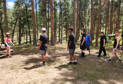 Longmont Youth Center students play games at the campsite during the overnight trip.