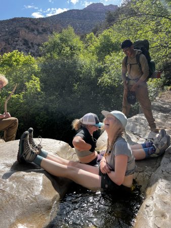 Changemakers cool off in a steam in Labyrinth Canyon.