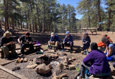 NVHS students find camaraderie around the campfire the day after they endured infamous Colorado weather than included rain-snow mix.