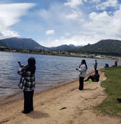 AXL student fish along a lake shore during their spring semester CAP class.