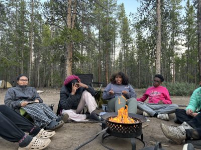 Students sit around the campfire during the DSST/LHC Watershed program.