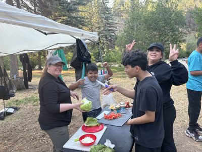 LYC students enjoy cooking on their overnight camping trip.