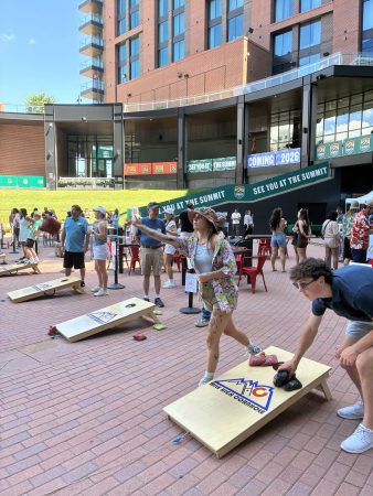 Participants throw bean bags during the 2025 Cottonwood Throwdown, a cornhole tournament.
