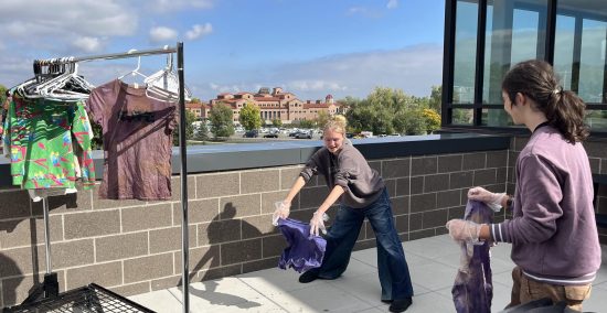 New Vista CAP students dry out their newly dyed t-shirts during their action project week.
