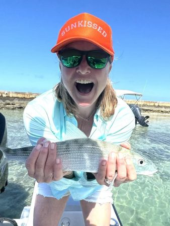 Headlamp Highlights is focusing on highlighting Cottonwood Board member Candace, who is showing off a fish she caught.